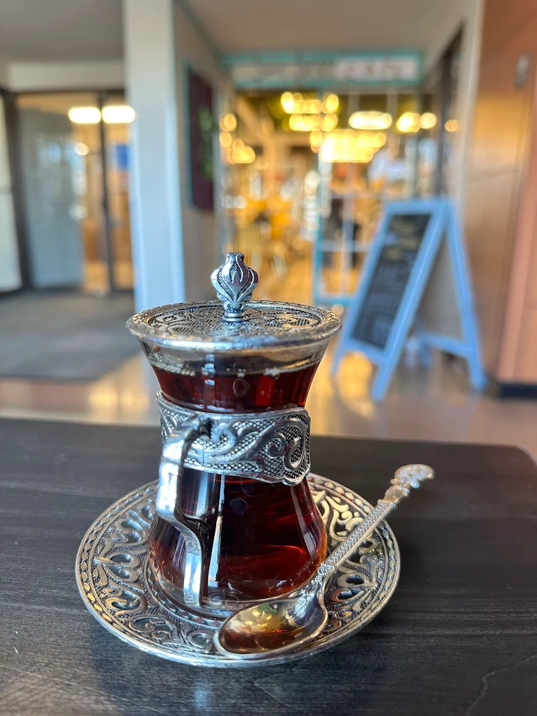 Turkish tea in front of the Seven Hills Istanbul Cafe storefront